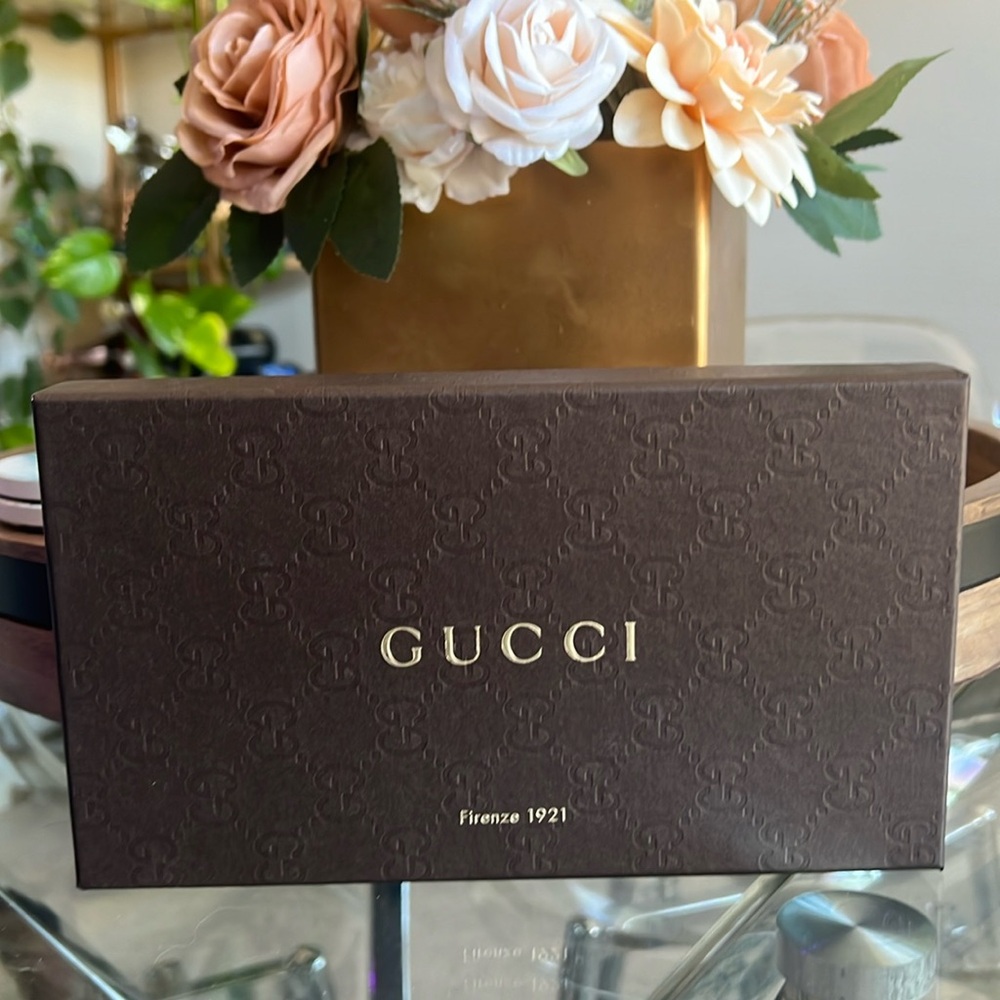 Gucci wallet long beige with purple leather lining and interior.